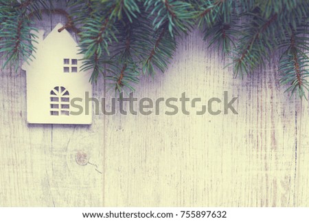 Christmas background. Christmas trees and Christmas decorations are on old light boards. Fir branches. Handmade decorations. Toned image. Space for text.
