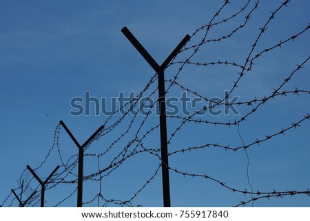 Iron Fence with blue sky background.