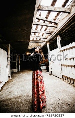 portrait of a girl in a stable