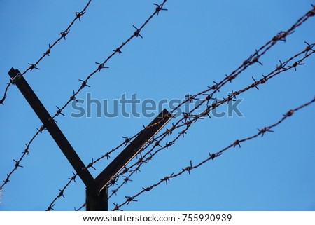 Close up of Iron Fence with blue sky background. 