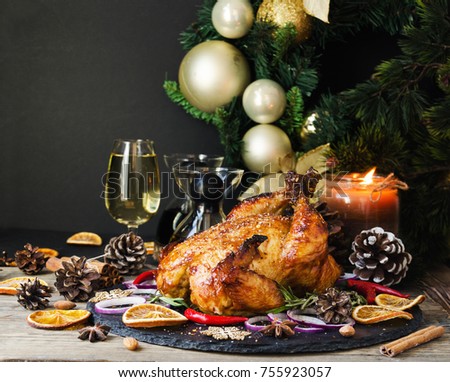 Roast chicken or turkey for Christmas and New Year Thanksgiving Day with mulled wine and Christmas decorations, space for text, selective focus