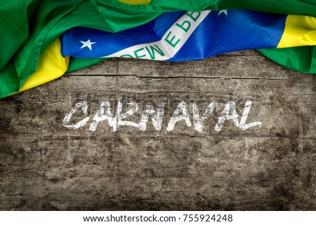 brazilian flag on s wooden background, with the word carnaval