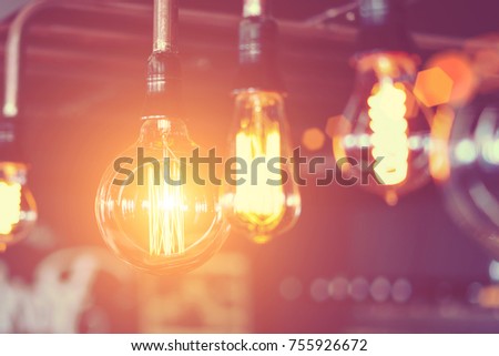 Row of glowing electric light bulbs Royalty-Free Stock Photo #755926672