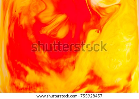 Orange oil paint on water abstract background.