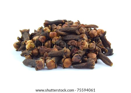 the spice clove in a pile isolated on white
