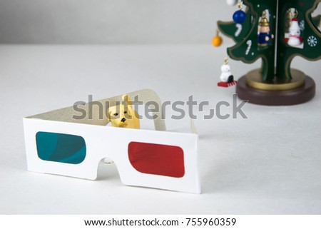 yellow figure of a dog and 3D glasses cardboard