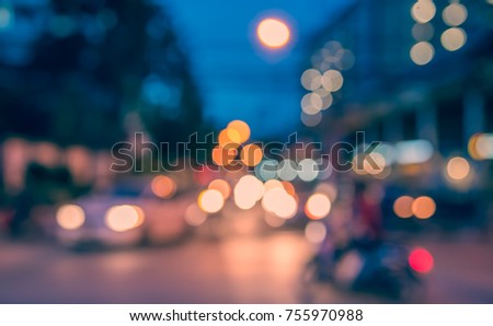 Abstract blur image of  Road in Night time with bokeh for background usage . (vintage tone)