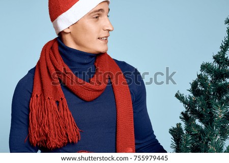 man holding a Christmas tree, new year background                               