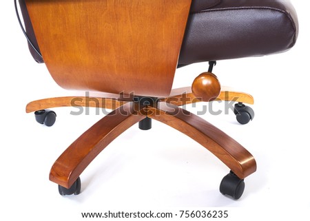 vintage leather office chair with armrests made of wood the color of whiskey on white background