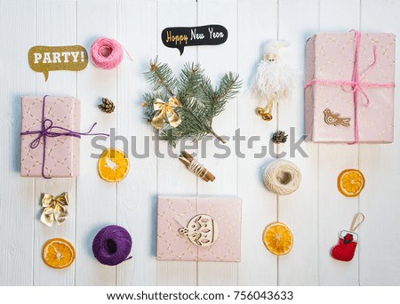 decorations for xmas and new year - tree, gifts, toys, pine cones, ropes, dried oranges, bows, cinnamon lays on the white background