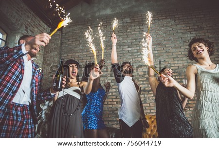 Group of friends celebrating and making party
