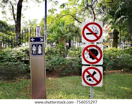 prohibition signs and toilet sign in the park