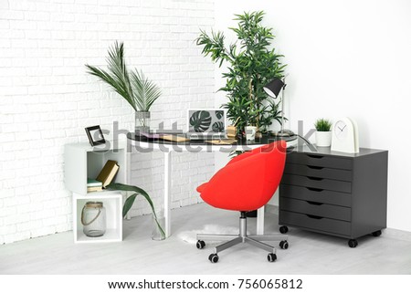 Modern room interior with laptop on table