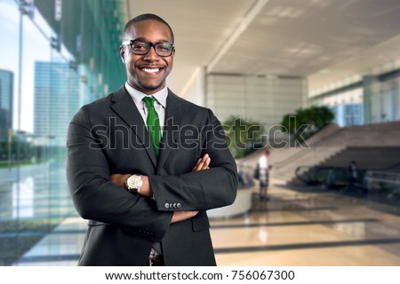 African american bank manager owner ceo business man standing confidently with pride in financial building Royalty-Free Stock Photo #756067300