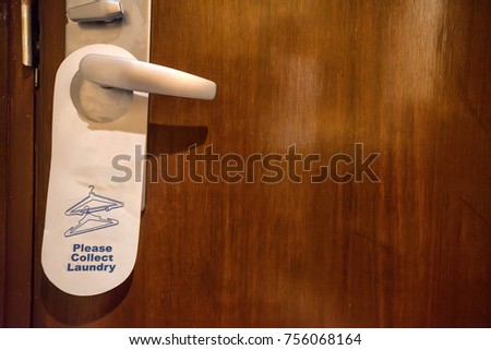Collect laundry sign on doorknob