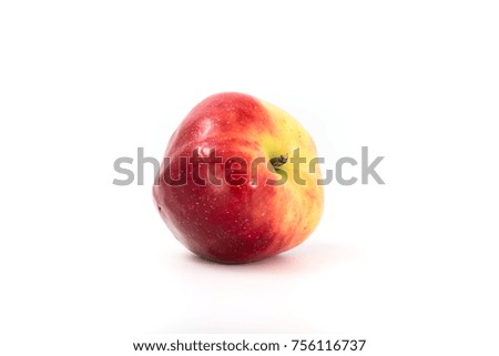 a large red ripe apple on white. Studio