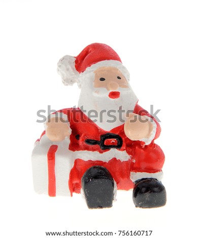 Christmas decoration trinket, Santa Claus in traditional costume with object specific to winter season, isolated on white background