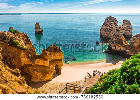 200 wooden stairs leading to Praia do Camilo, Algarve, Portugal Royalty-Free Stock Photo #756182530