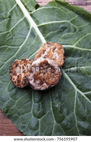 Nutrition concept - Healthy hamburgers with cabbage leaf over wooden background. Healthy food, Diet, Detox, Clean Eating or Vegetarian concept