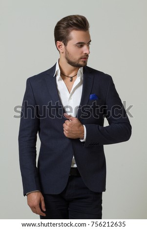 Businessman in suit in the studio on a light gray background Royalty-Free Stock Photo #756212635