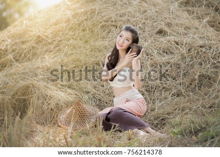 country girl portrait in outdoors,Happy rural girl smiling in field,portrait of a happy young asian woman.