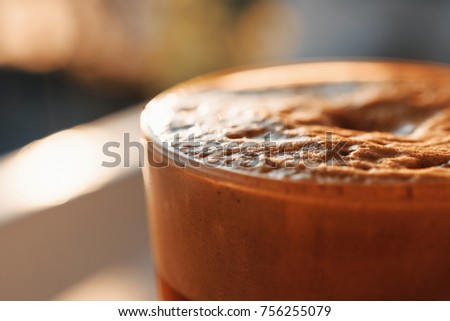 Iced Coffee In Tall Glass With Foam And Bubbles