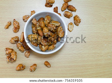 Sugar Coated Peanuts,on top,wood background Royalty-Free Stock Photo #756319105