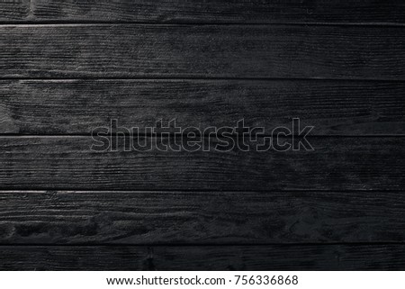 
Wooden dark texture background. Free space for your text. Top view.