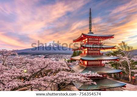 Fujiyoshida, Japan at Chureito Pagoda and Mt. Fuji in the spring with cherry blossoms. Royalty-Free Stock Photo #756354574