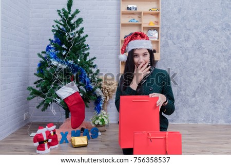 Happy young woman with the Christmas tree, New year concept