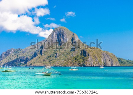 Beautiful tropical islands, Filipino boats in the sea. Scenic tropical landscape, El Nido, Palawan, Philippines, Southeast Asia.  Sea bay scenery. 