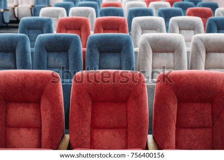 red and blue armchairs