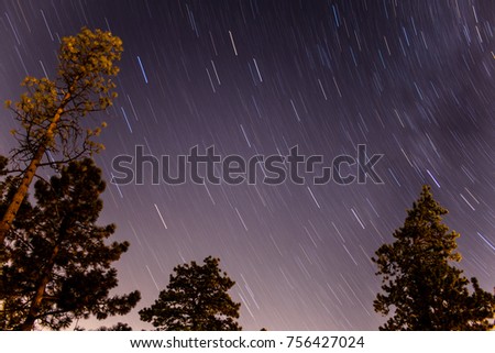 The starry night of the Big Bear, California sky as the stars revolve around the Earth.