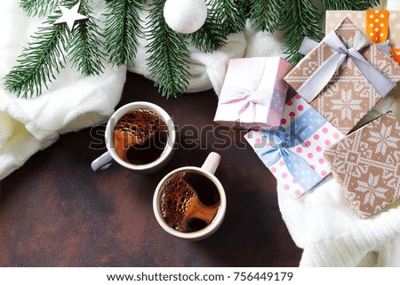 two cups of coffee and fir branches