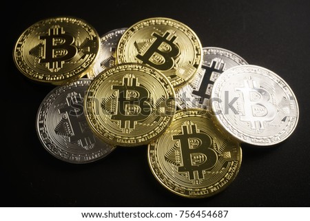 Pile of bitcoin coins on black background