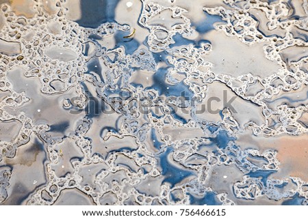detail of water at a metal table