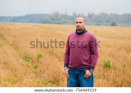 a young guy in the background fields man