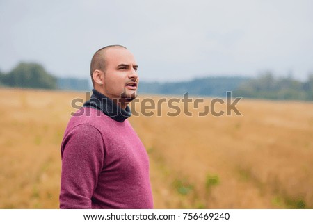 a young guy in the background fields man