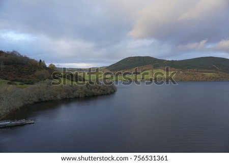 This is a photo of beautiful lake in Scotland in autumn. The trees have many colors. It is such a nice place and peaceful. 