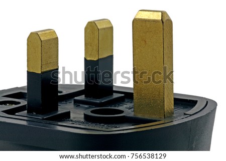 side view of a plug –  A three pin UK plug isolated on a white background
