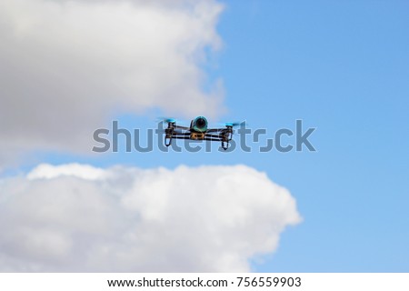 Blue drone flying on the sky