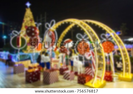 Blurred - Bangkok Thailand, December 14, 2016:- Merry - Xmas - Christmas tree in the garden at Department store  At night. A lot of people take pictures and happy.