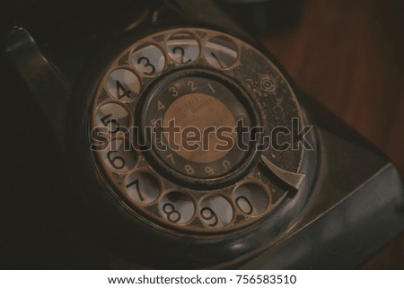 Vintage telephone on wooden table. concept of remembrance and nostalgia.