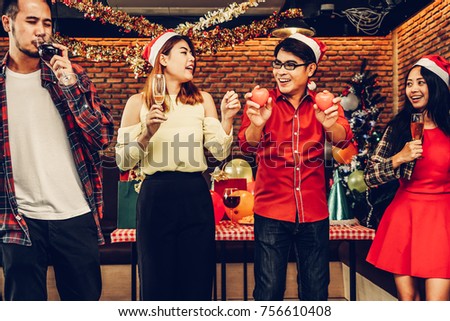 Group of asian men and women Together Enjoying Christmas and New Year party holiday celebration.