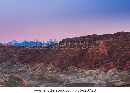 Beautiful scenery with red rock geologic formations in the Utah desert, at sunset