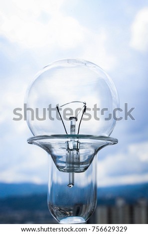 light bulb on a blue urban background
