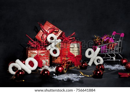 Black Friday abstract photo. Happy Merry Christmas. Shopping cart with decorative presents.