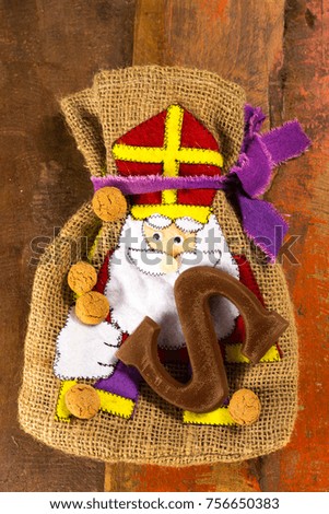 Traditional Dutch Saint Nicolas celebration with presents for children in December, Saint Nicolas  gift bag and chocolate letters close up
