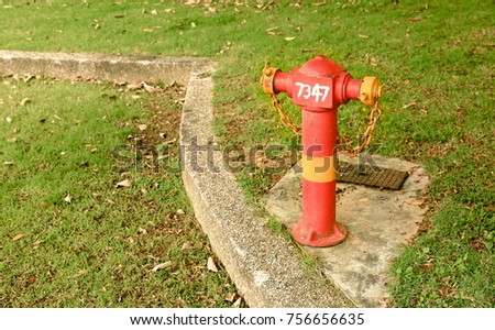 Red fire hydrant at side walk  