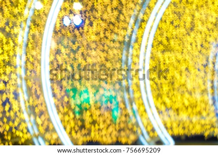 Blurred star tunnel yellow night light bokeh christmas holiday abstract sign